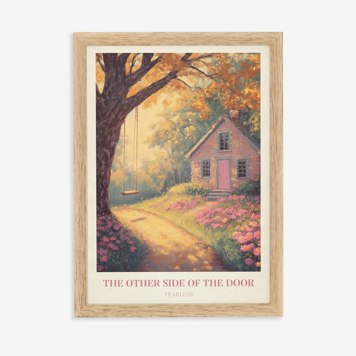 The Other Side Of The Door Taylor Swift print of a brick cottage with a pink door and a tree swing, in an oak frame on a plain wall