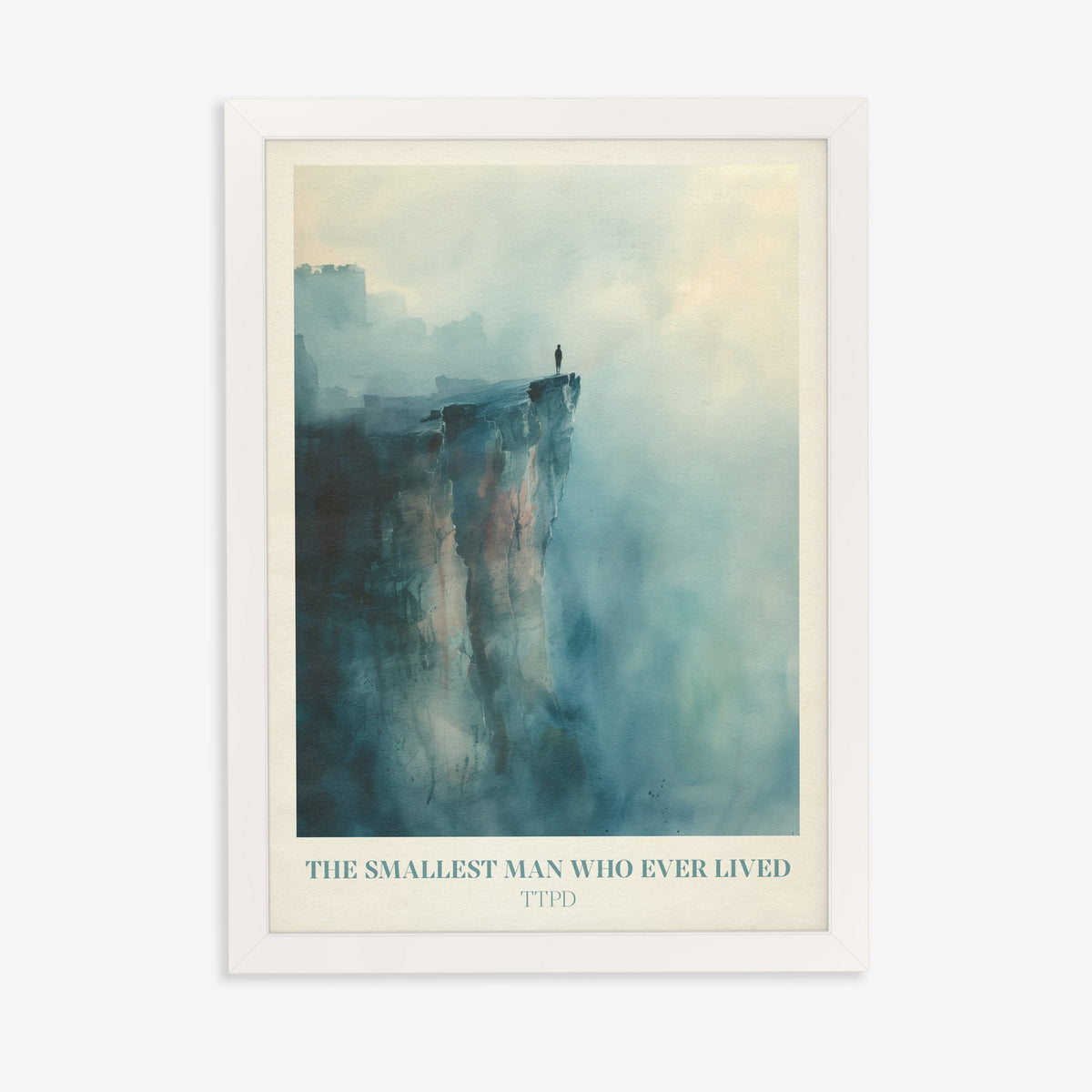 The Smallest Man Who Ever Lived Taylor Swift print of a lone figure on a misty blue cliff, in a white frame on a plain wall