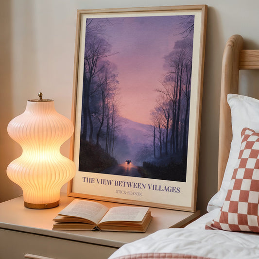 The View Between Villages lyric wall art print inspired by Noah Kahan on a bedside table next to a lamp