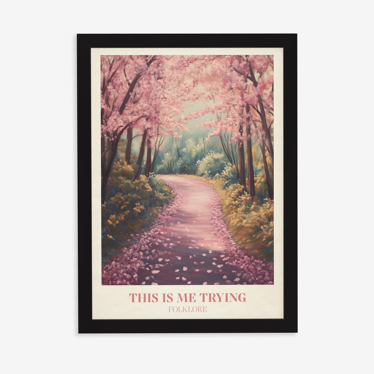 This Is Me Trying Taylor Swift print of a winding path under pink blossom trees, in a black frame on a plain wall