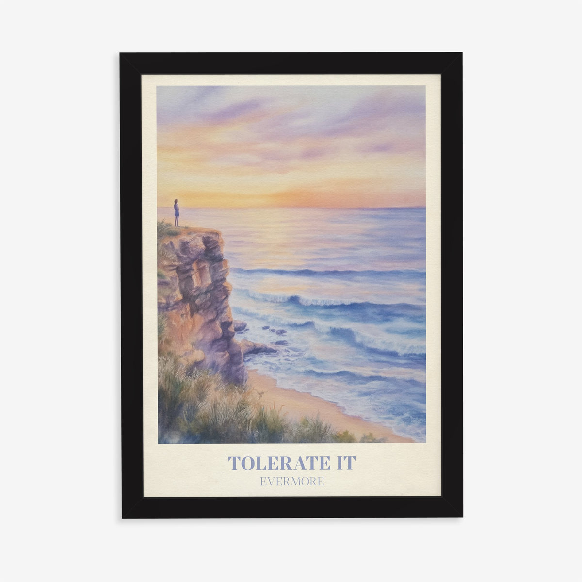 Tolerate It Taylor Swift print of a lone figure on a clifftop above a lilac sunset sea, in a black frame on a plain wall