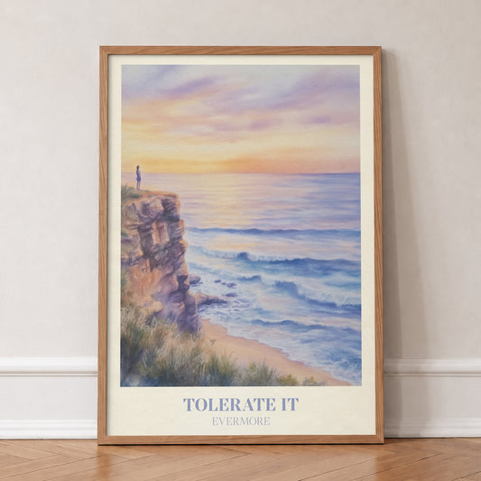 Tolerate It Taylor Swift print of a lone figure on a clifftop above a lilac sunset sea, in an oak frame, leaning against a wall on a herringbone floor