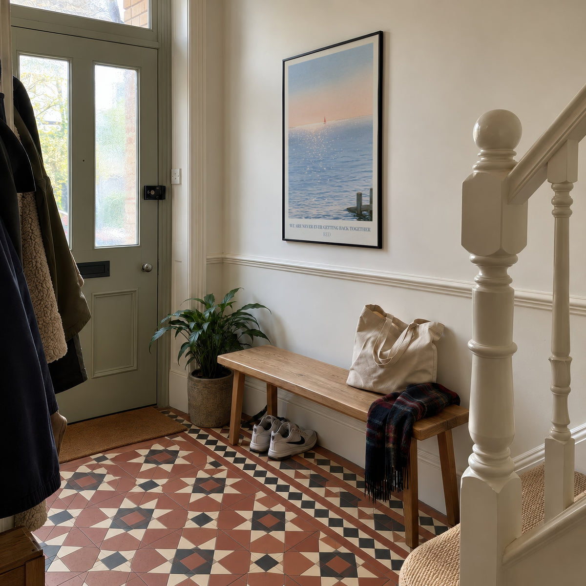We Are Never Ever Getting Back Together Taylor Swift print of a red sailboat, hung in a hallway with Victorian floor tiles