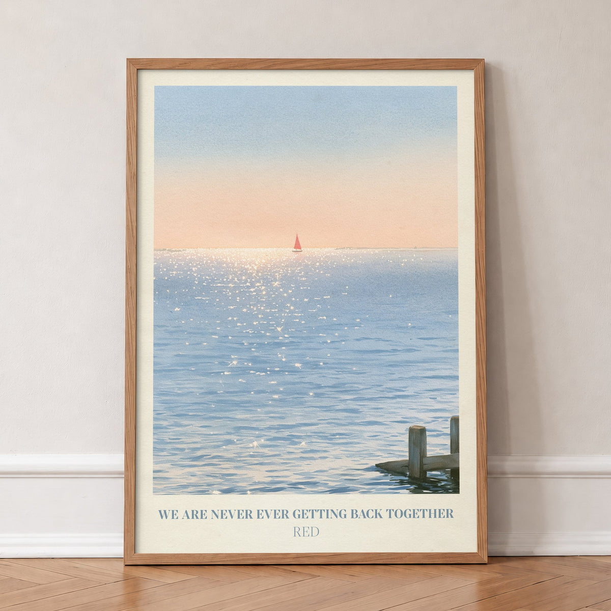 We Are Never Ever Getting Back Together Taylor Swift print of a red sailboat, in an oak frame, leaning against a wall on a herringbone floor