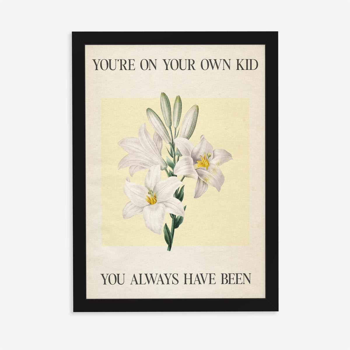 You’re On Your Own Kid Botanical Taylor Swift lyric print of white lilies on yellow, in a black frame on a plain wall
