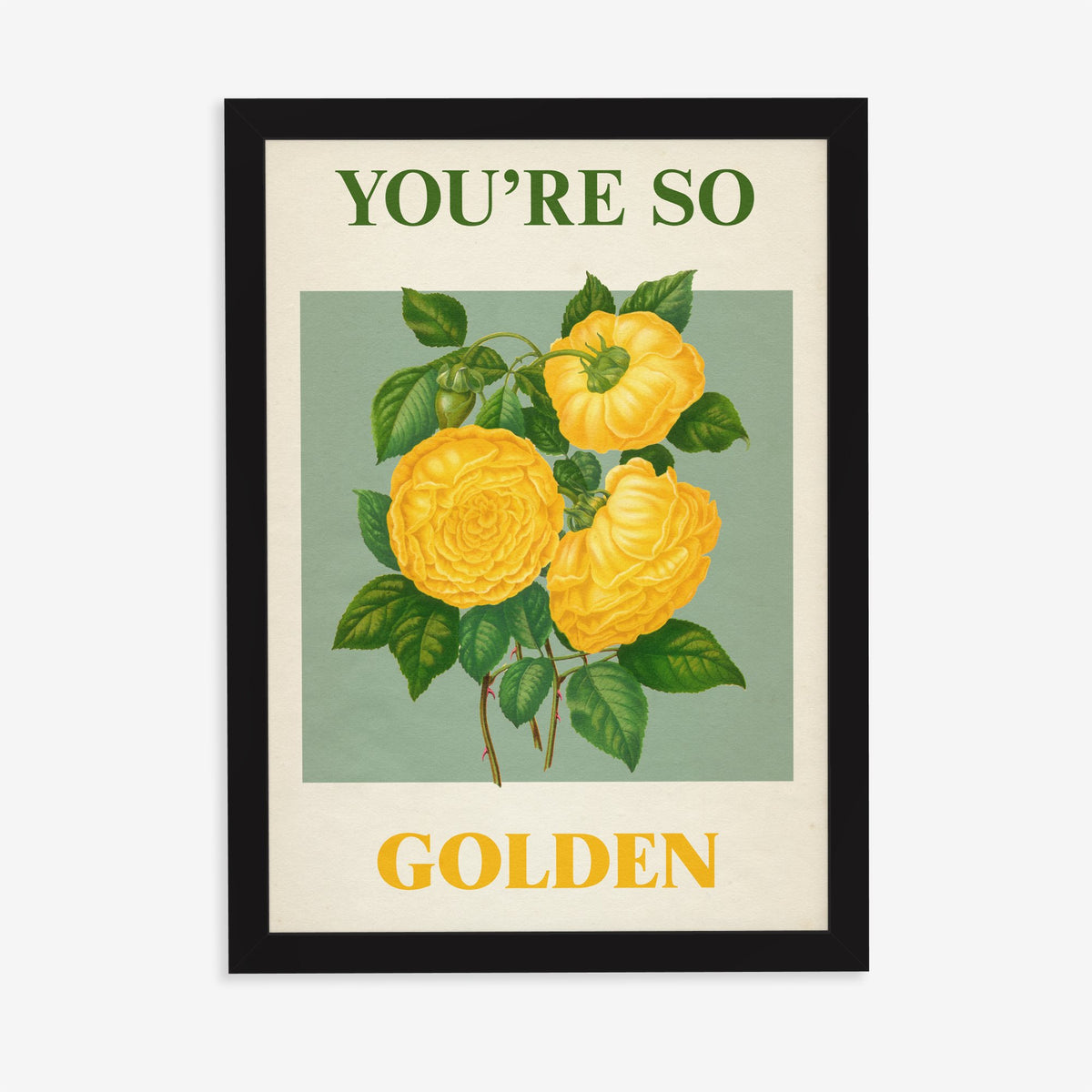 You're So Golden Harry Styles print of yellow roses on sage green, in a black frame on a plain wall