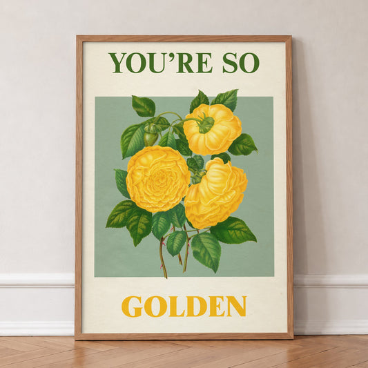 You're So Golden Harry Styles print of yellow roses on sage green, in an oak frame, leaning against a wall on a herringbone floor