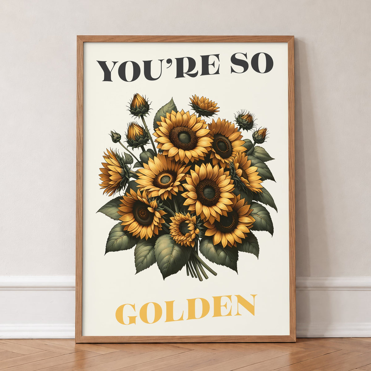 You're So Golden Harry Styles print of a sunflower bouquet on cream, in an oak frame, leaning against a wall on a herringbone floor